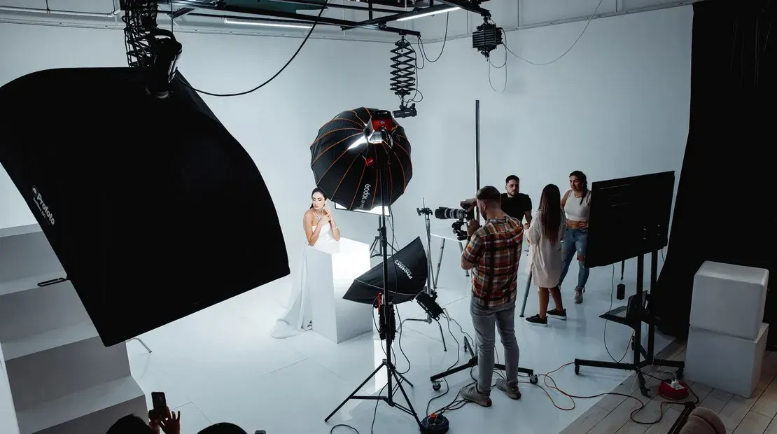 Photographer at work on the white set at SkyLight Studio